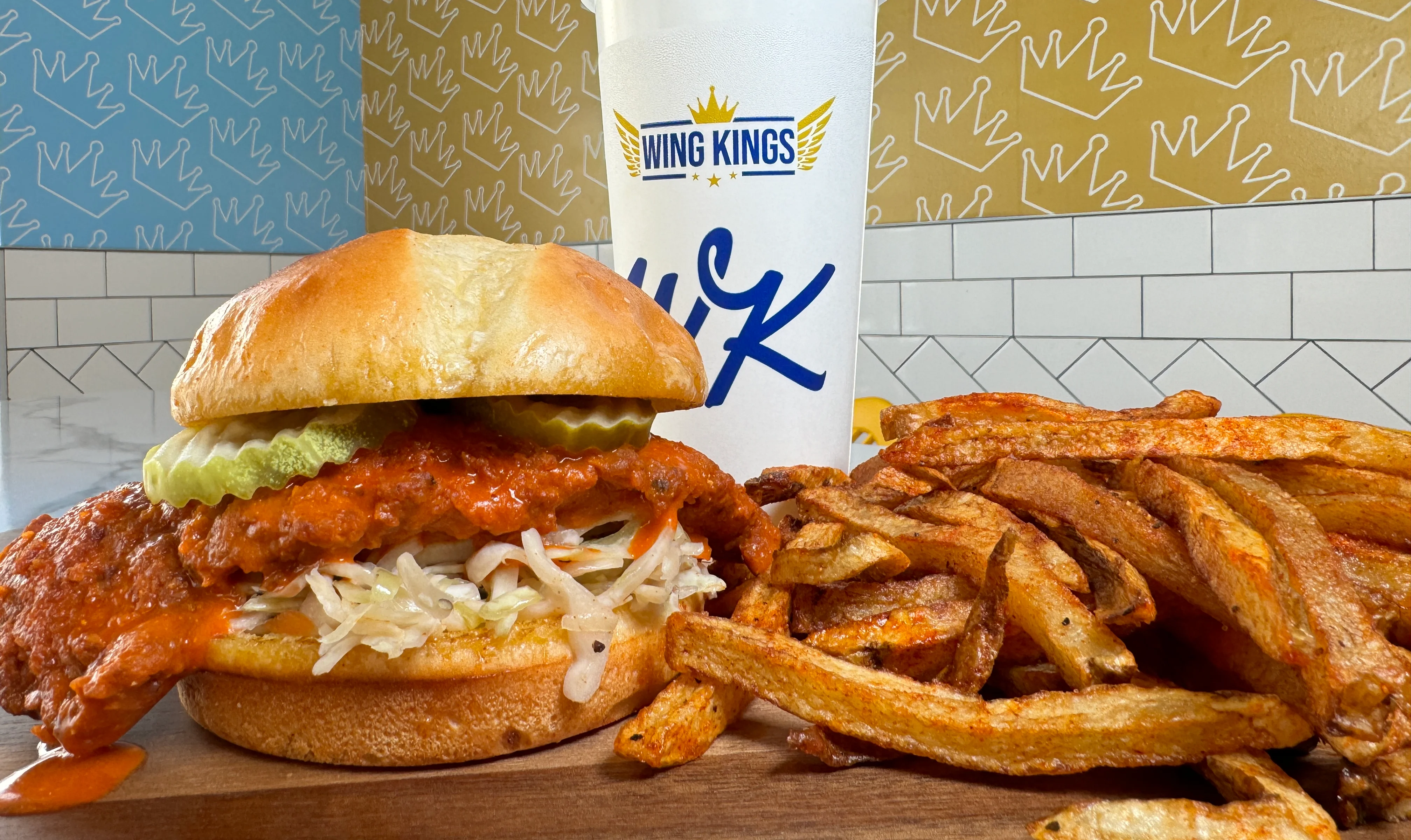 Spicy fried chicken sandwich with pickles and fries