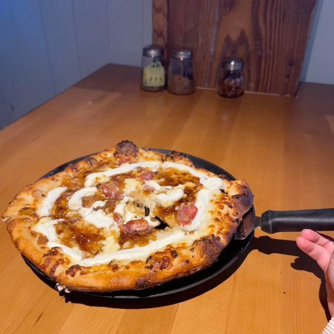 Savory white pizza with creamy sauce and toppings