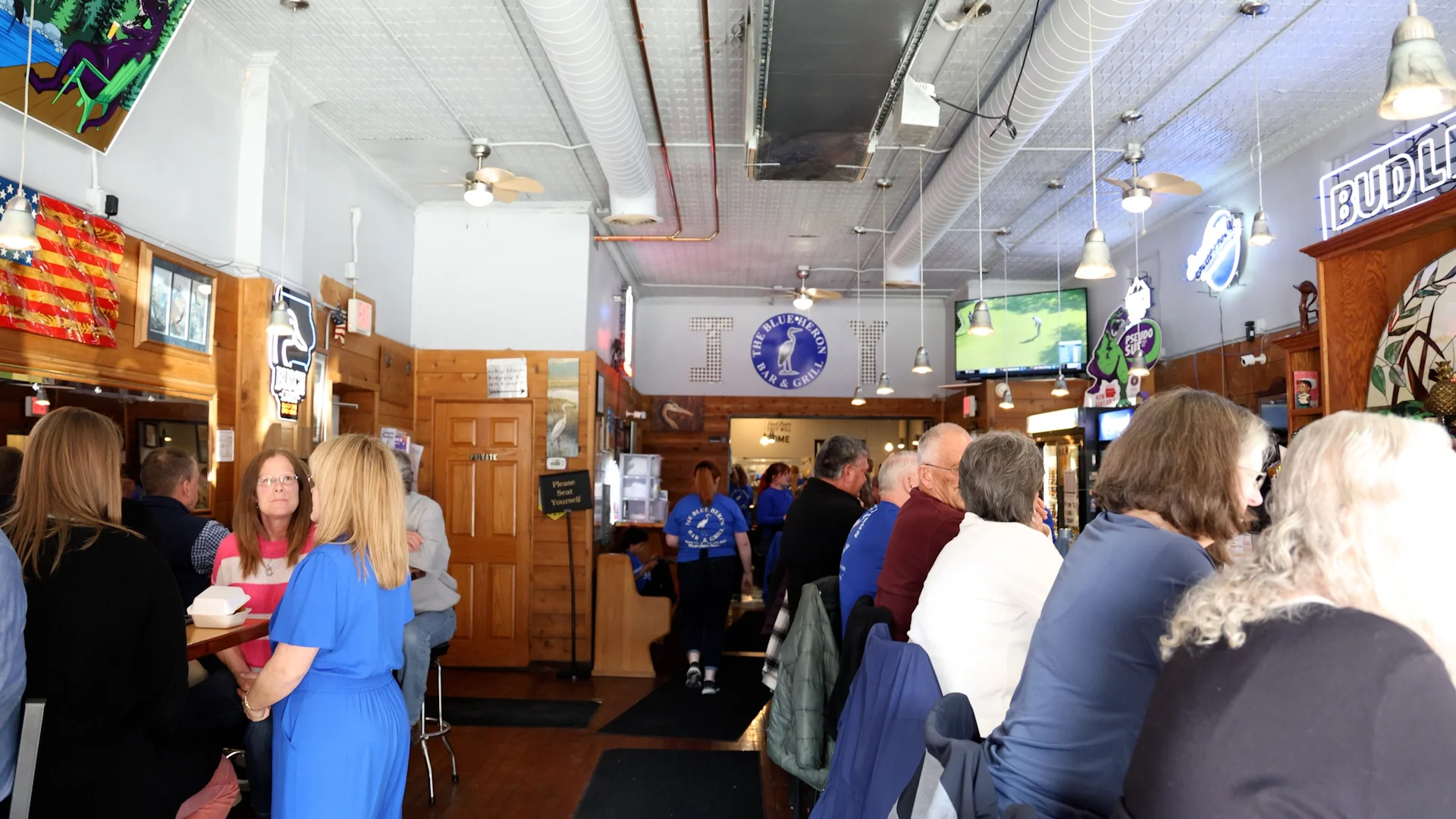 Interior of The Blue Heron Bar & Grill with patrons enjoying their meals.