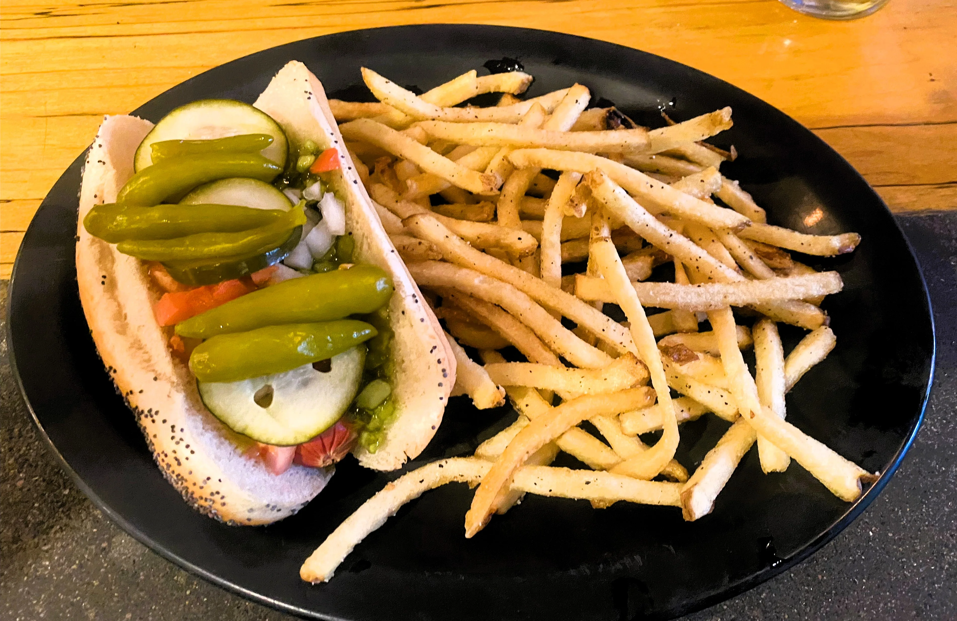 Restoration Brew Worx chicago style hot dog with house made french fries