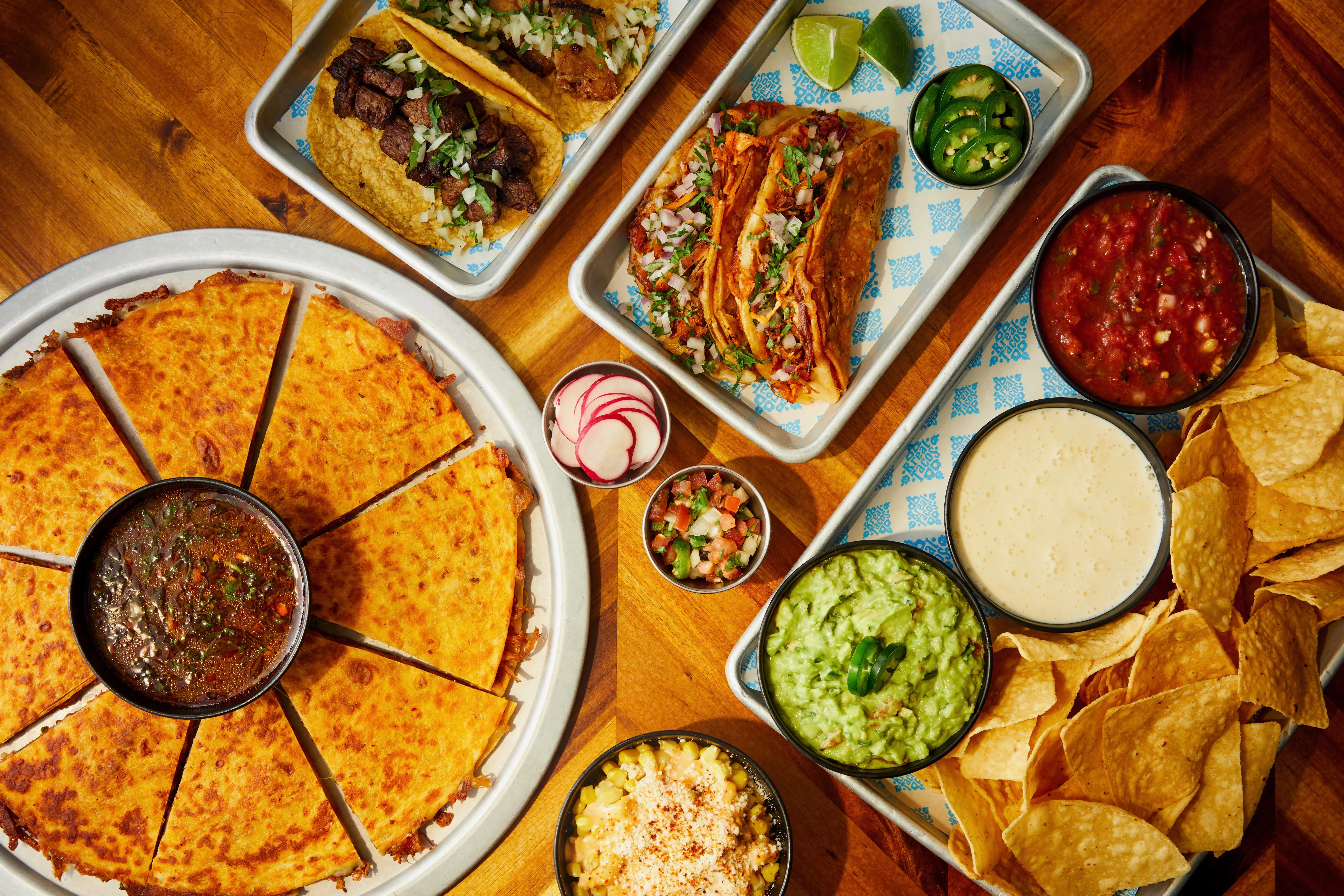 Delicious Mexican tacos with quesadilla and sides