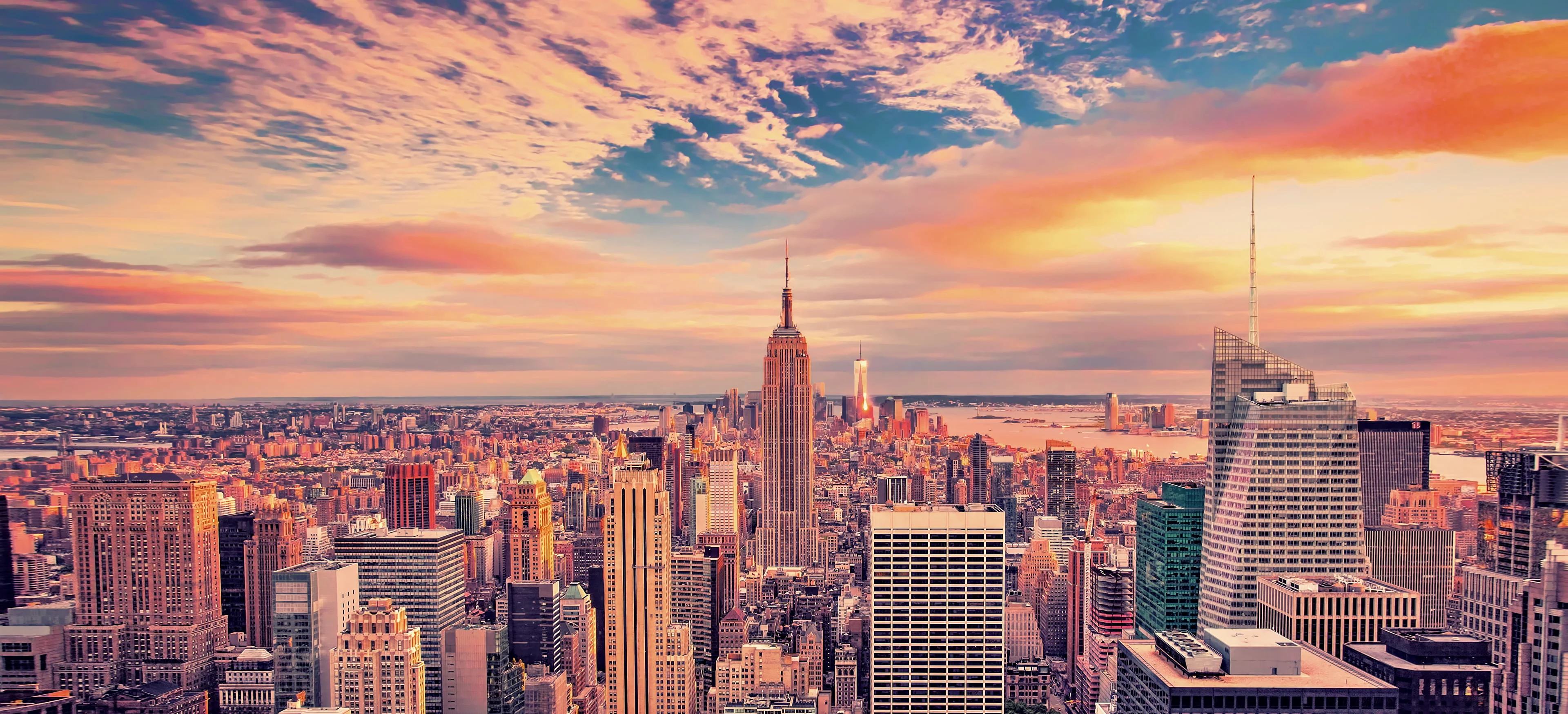 Panoramic view of New York City skyline at sunset
