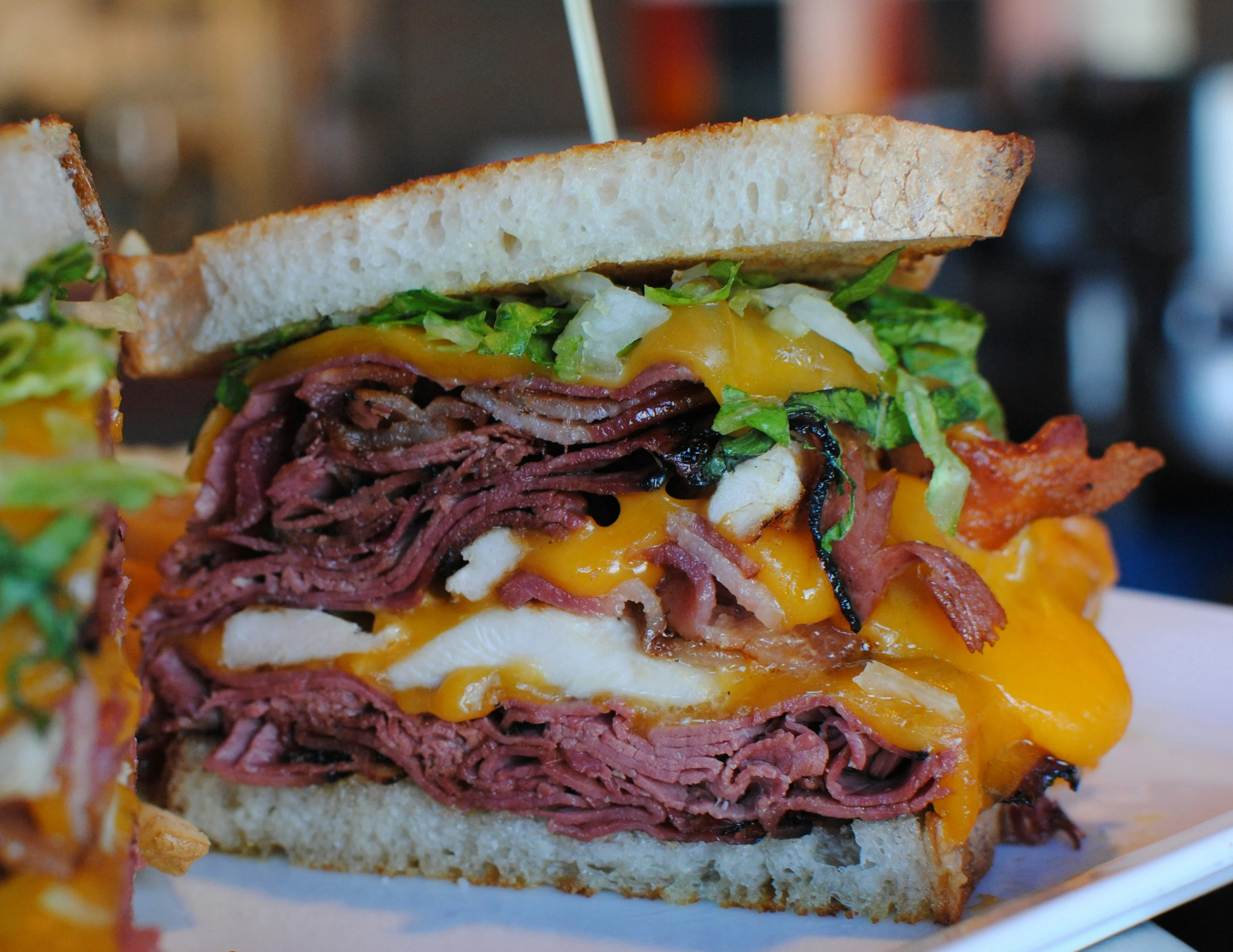 Hearty pastrami sandwich with cheddar cheese