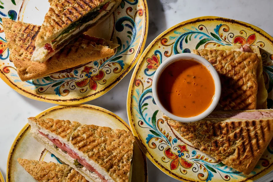 Italian deli sandwiches with lemonade and pickles