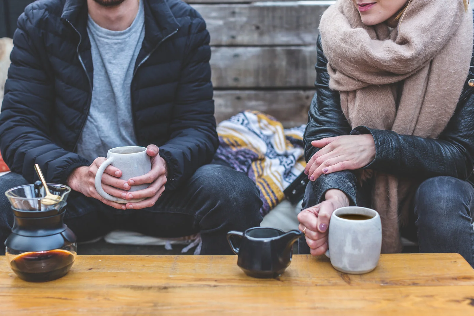 Couple enjoying coffee in a cozy setting