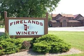 Exterior view of Firelands Winery with lush greenery and inviting entrance.
