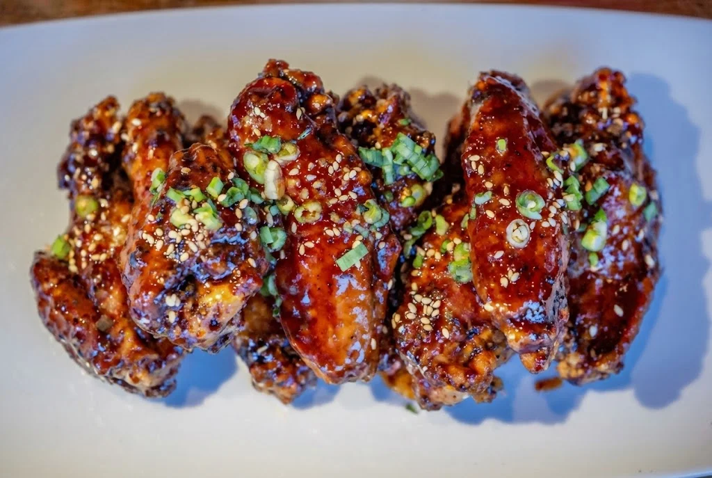 Korean-style spicy chicken wings with sesame and green onions