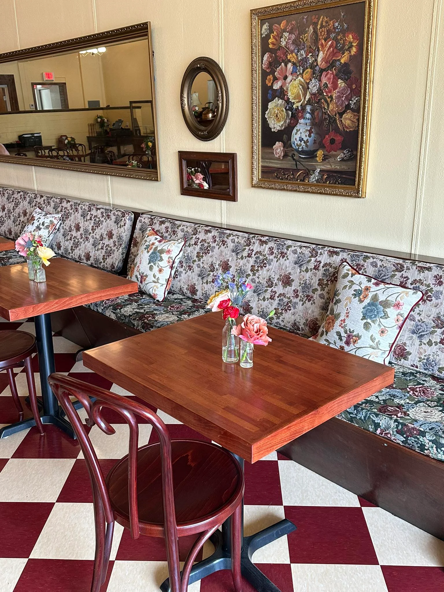 Charming restaurant interior with floral decor and cozy seating
