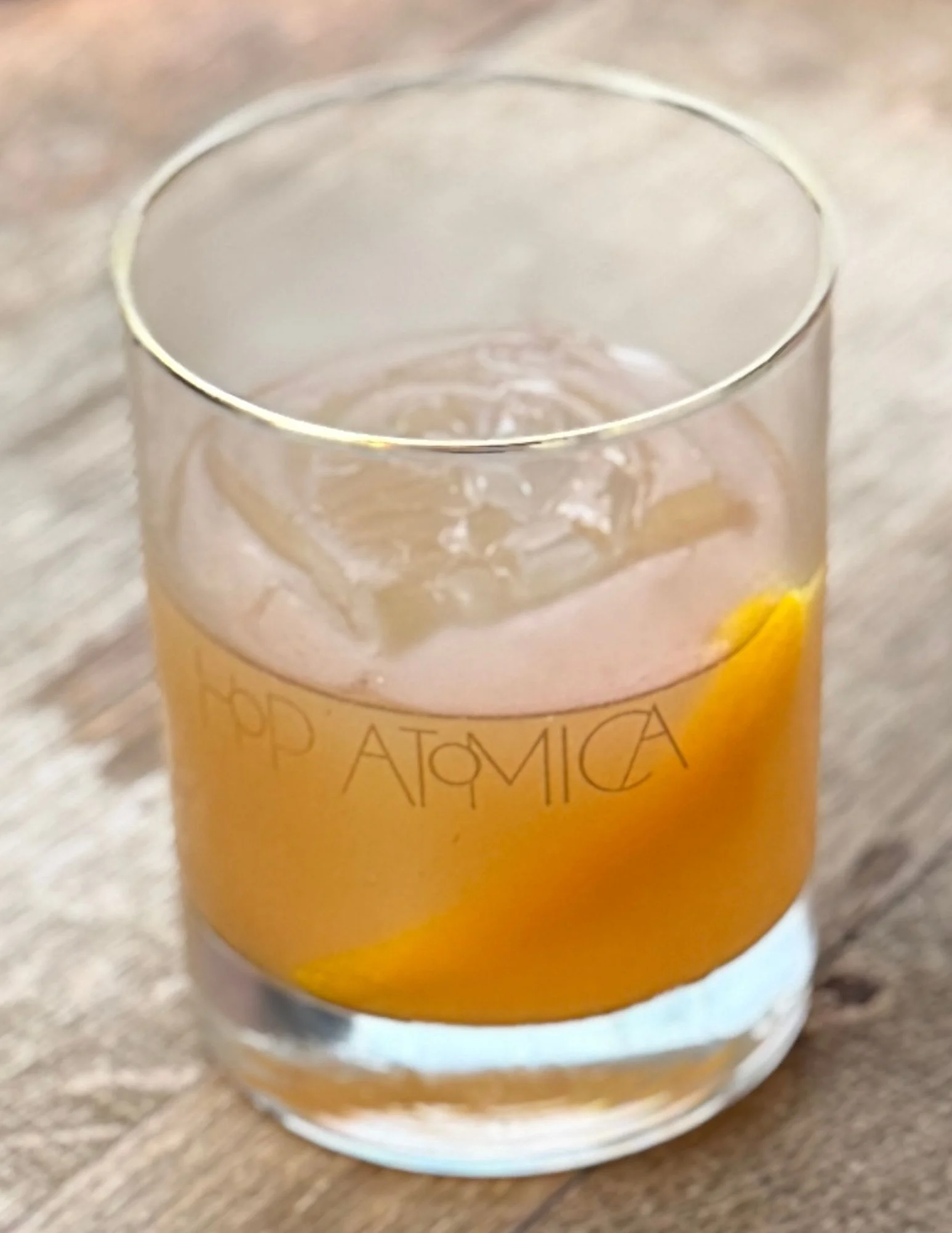 Craft cocktail with caramel notes and orange garnish