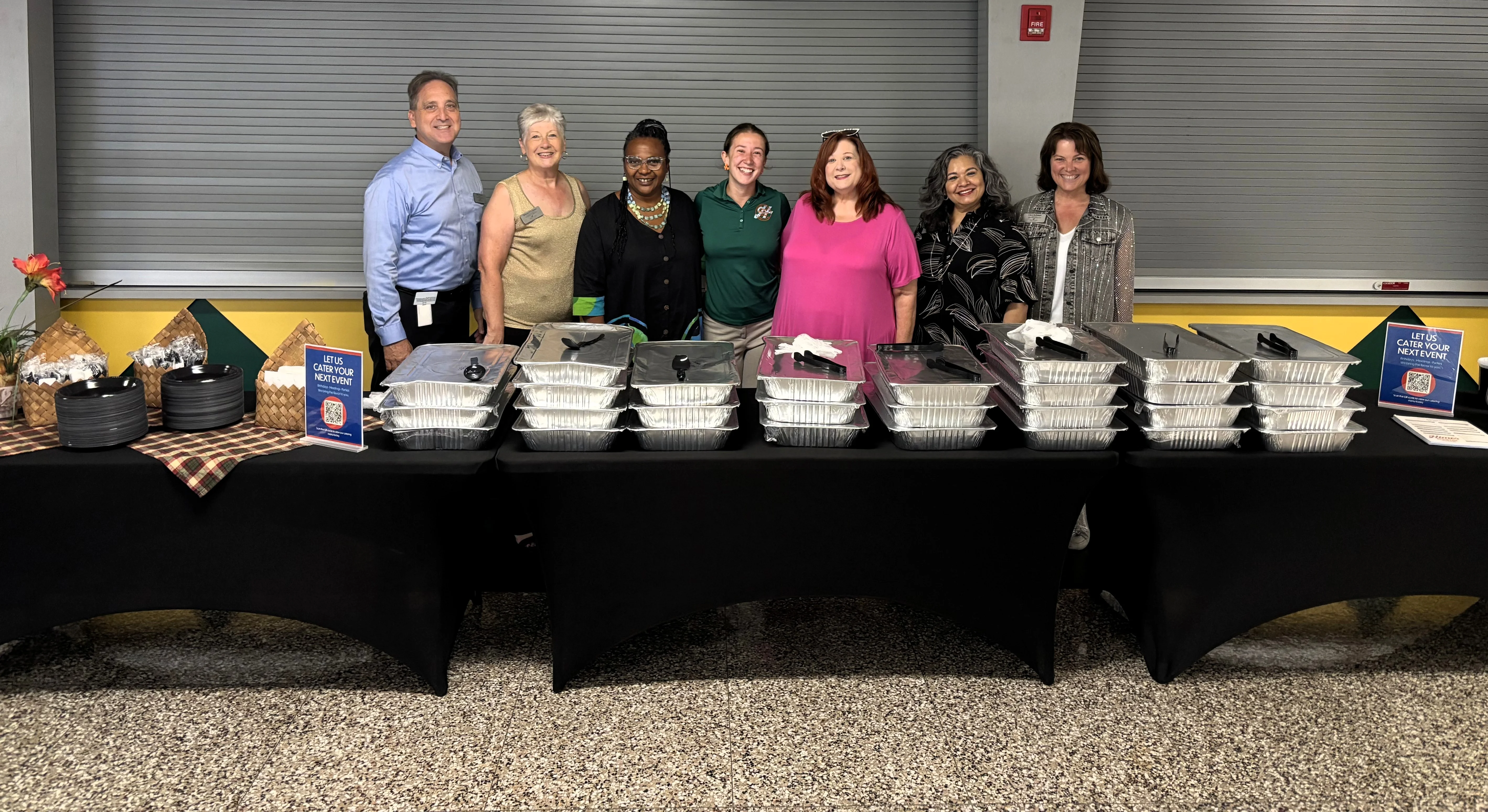 Catering team with food trays ready for an event
