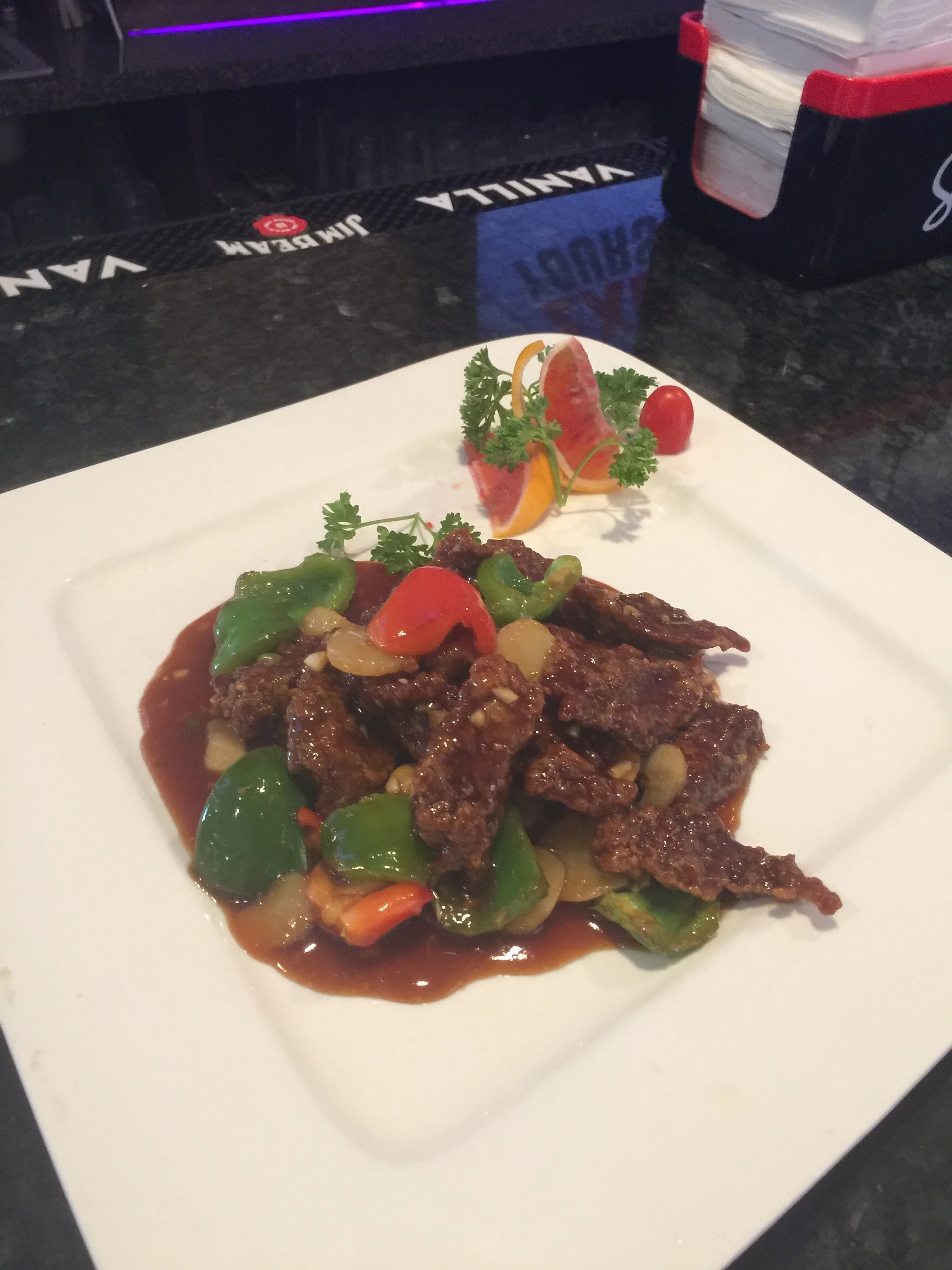 Crispy beef stir-fry with bell peppers in a savory sauce