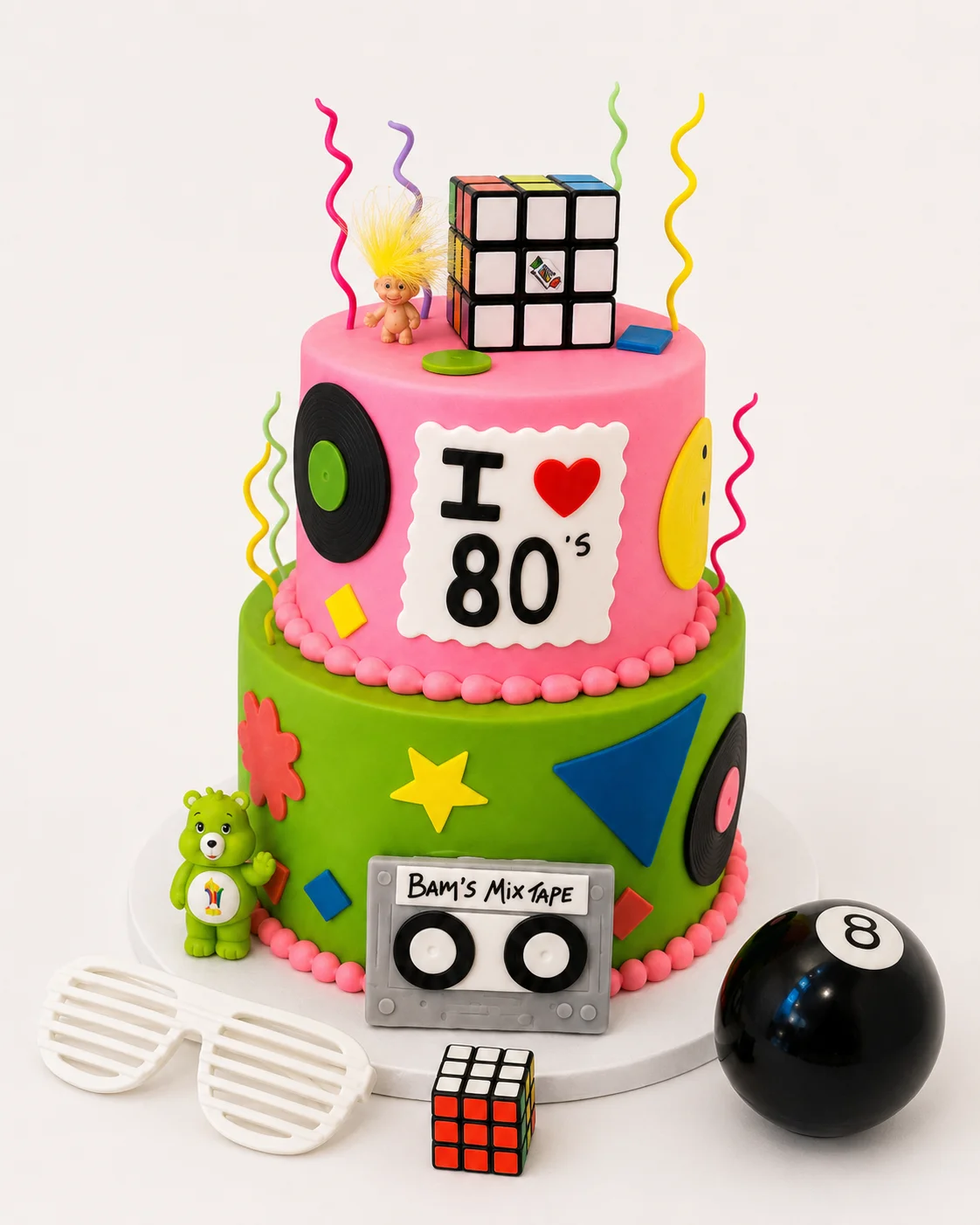 Colorful 80's themed birthday cake with playful decorations
