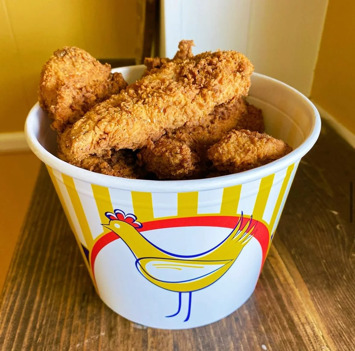 Crispy fried chicken tenders in a bucket