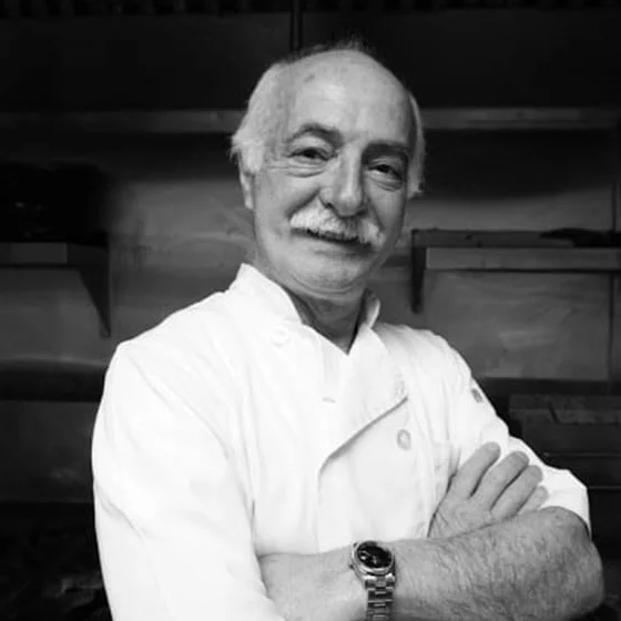 Chef preparing a dish in a modern restaurant kitchen