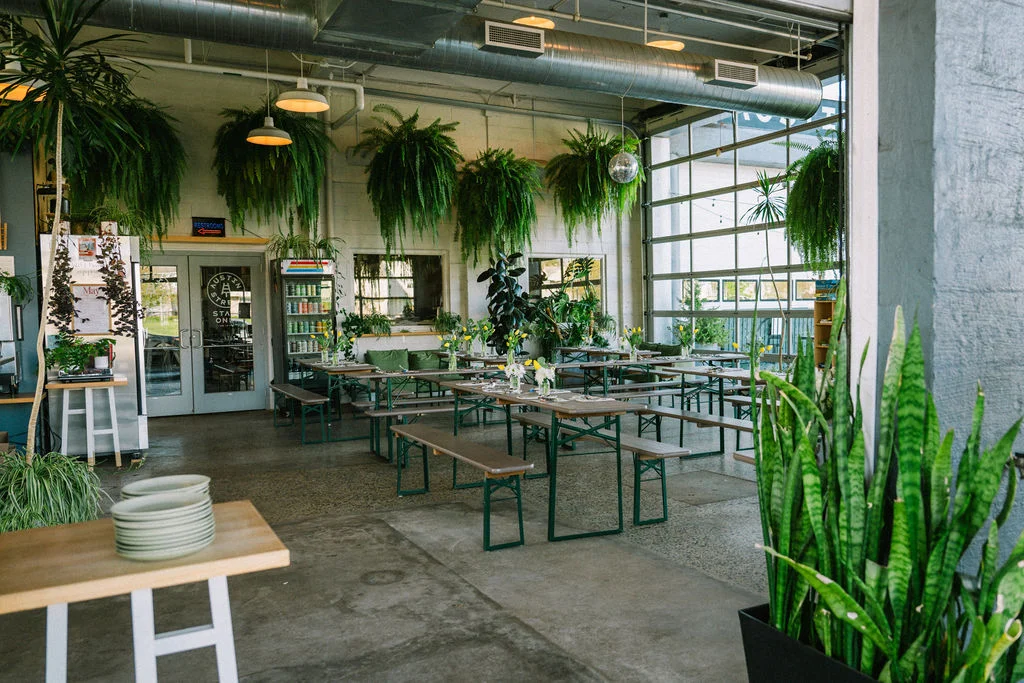 Bright and airy restaurant interior with lush greenery