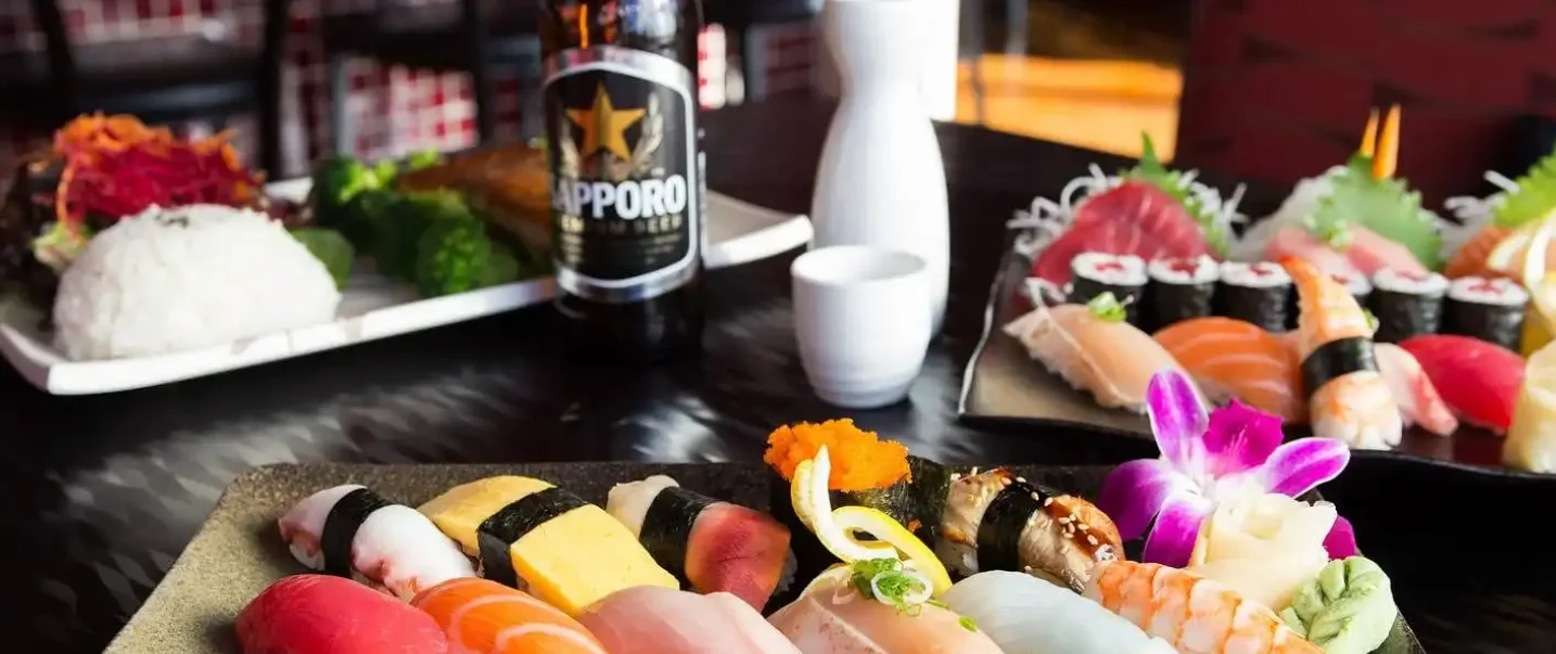 Assorted sushi platter with sake and beer in a Japanese restaurant