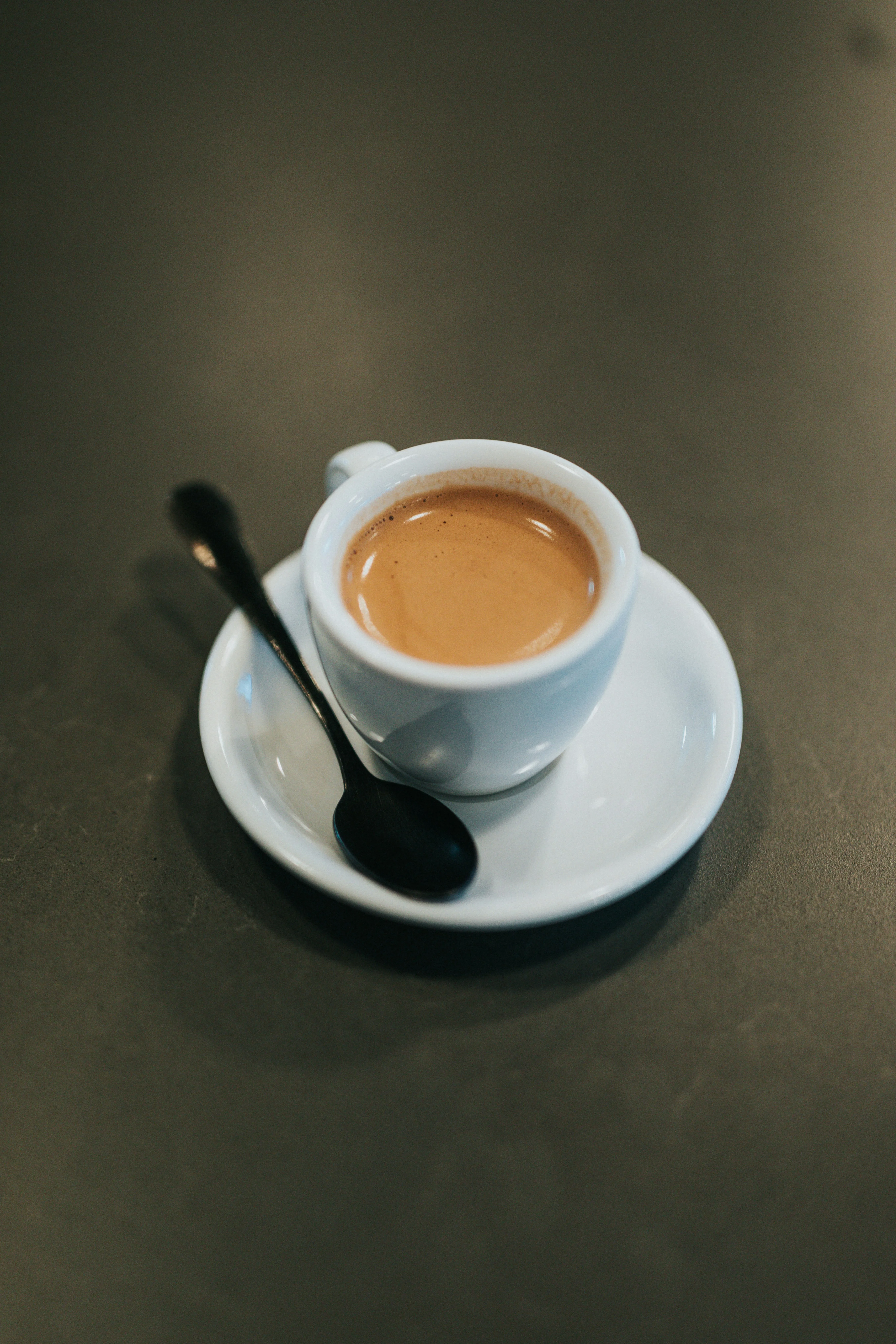 Rich espresso served in a white cup on a saucer