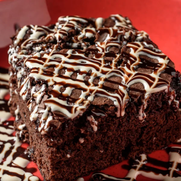 Fudgy chocolate brownie drizzled with vanilla and chocolate sauce at VooDoo BBQ Pensacola.