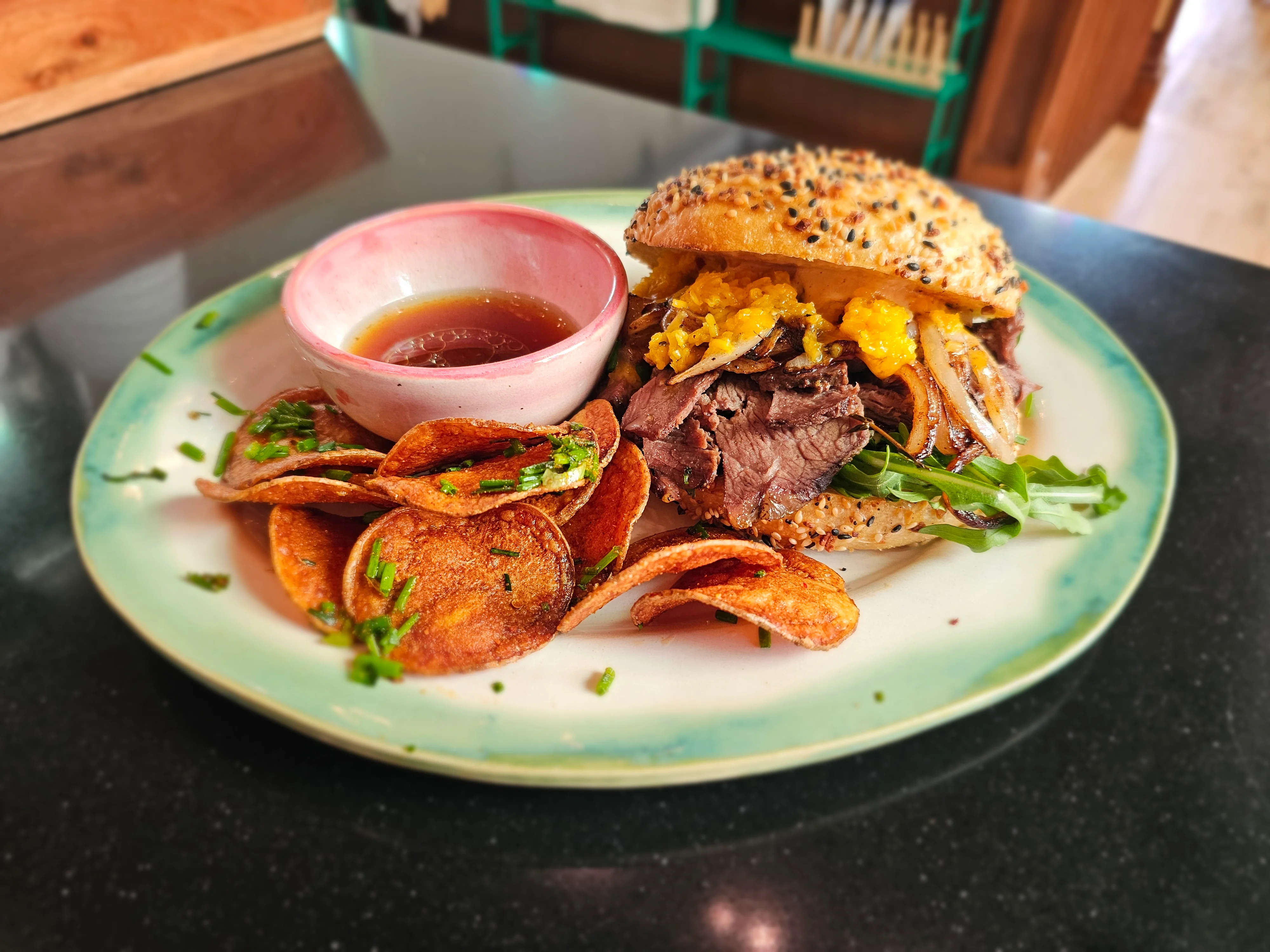 Bagel sandwich with scrambled eggs and arugula