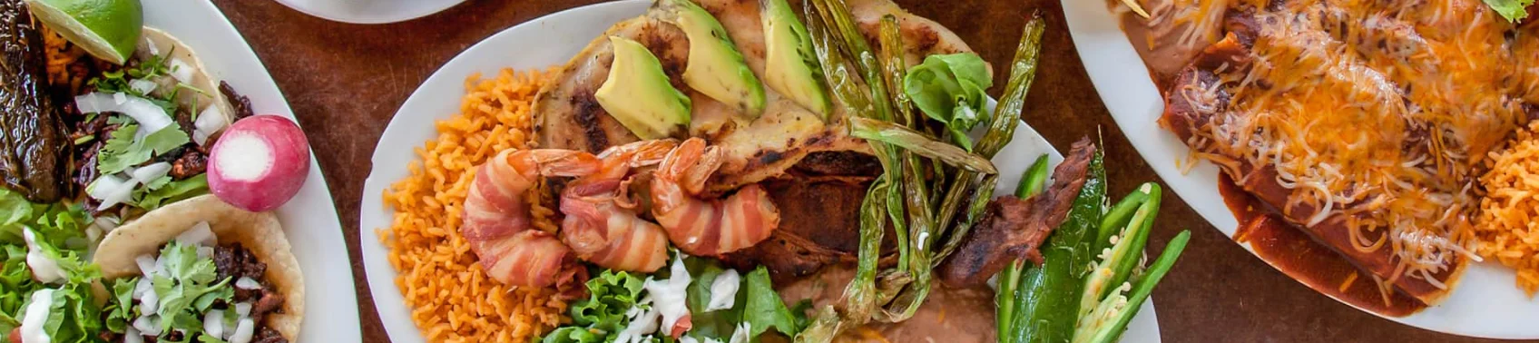 Mexican mixed grill platter with shrimp and tacos