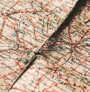 Close-up of a vintage map with intricate details and road markings