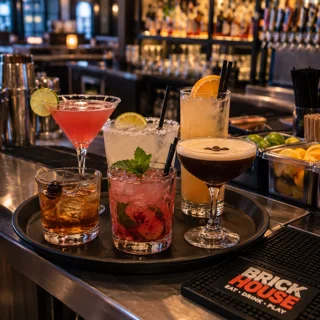 Colorful cocktails on a tray at a modern bar