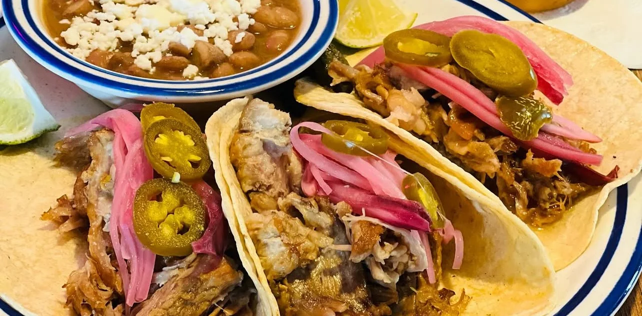Authentic Mexican tacos with beans and cheese
