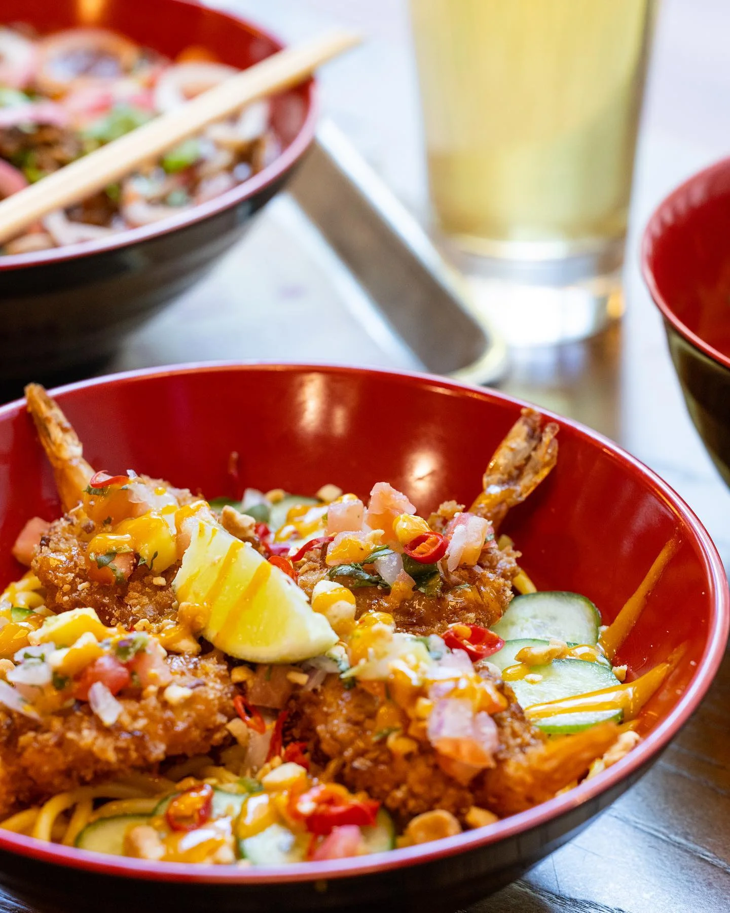 Crispy shrimp bowl with noodles and fresh toppings