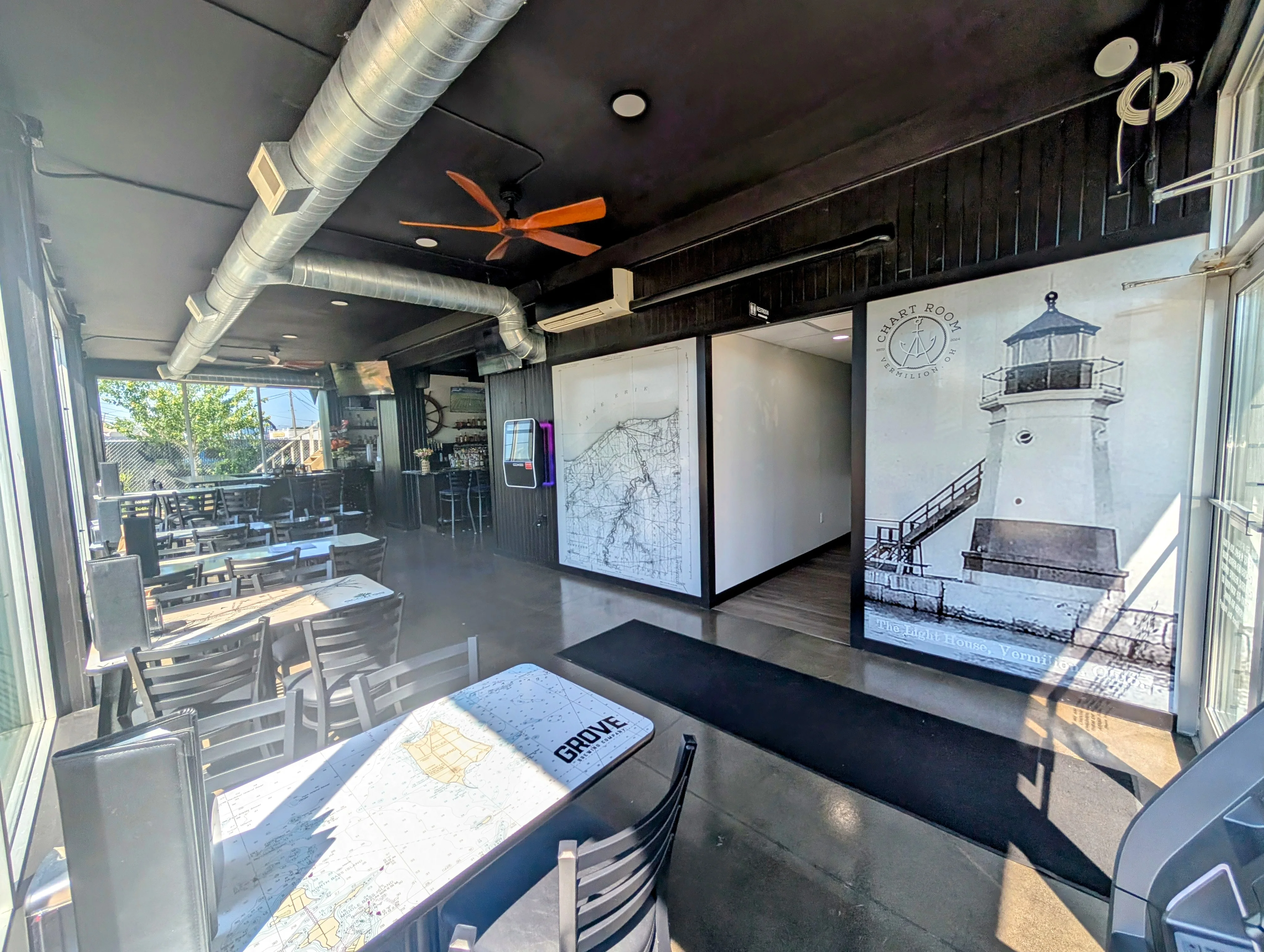 Modern restaurant interior with nautical decor and seating