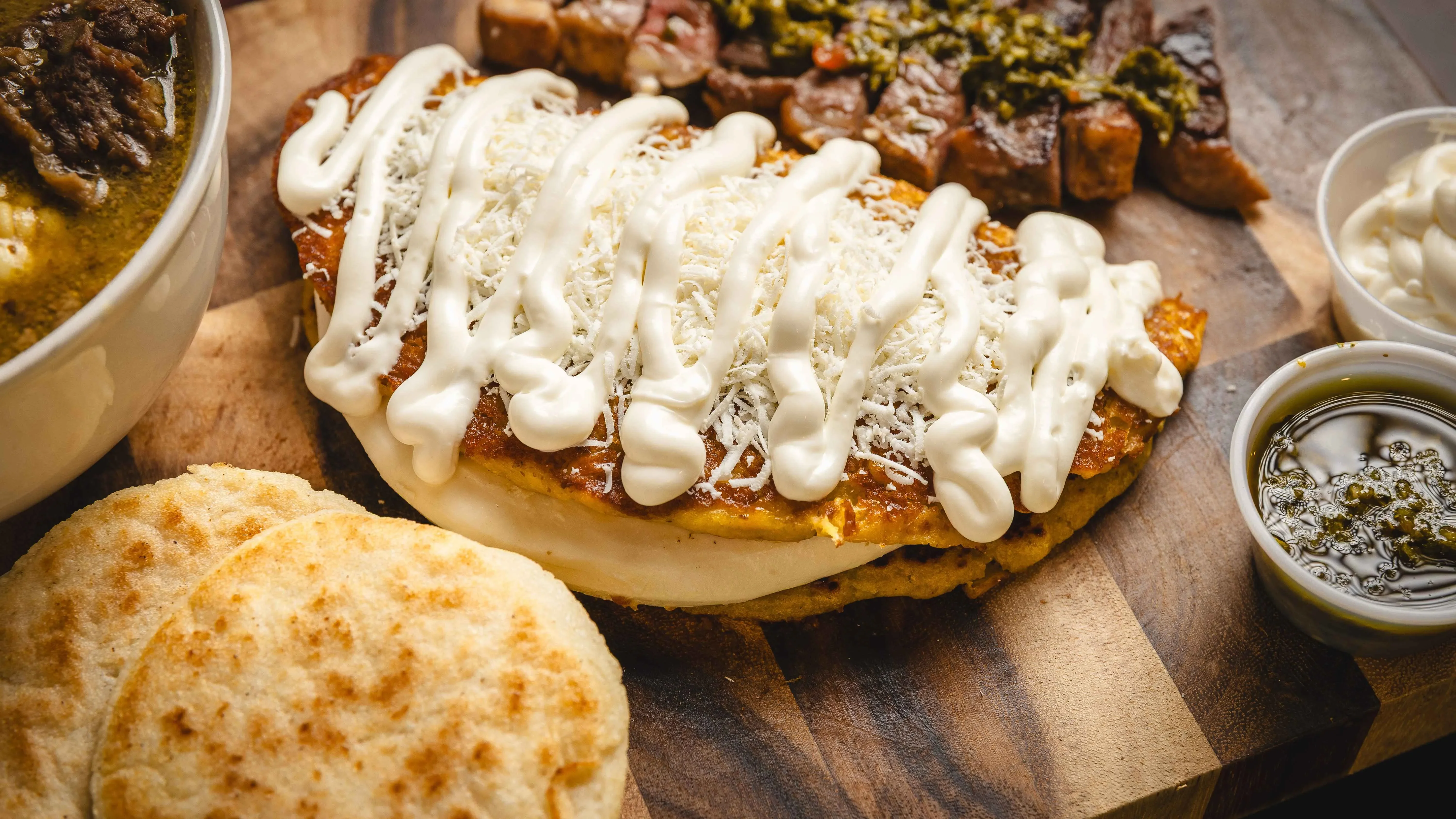 Delicious gourmet burger with fresh toppings on a wooden table