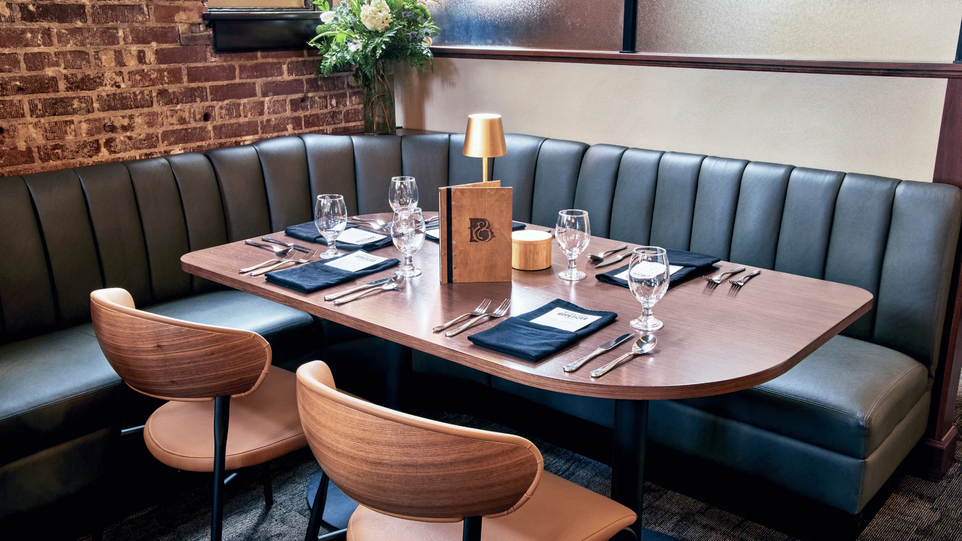 Cozy restaurant interior with elegant seating and warm lighting