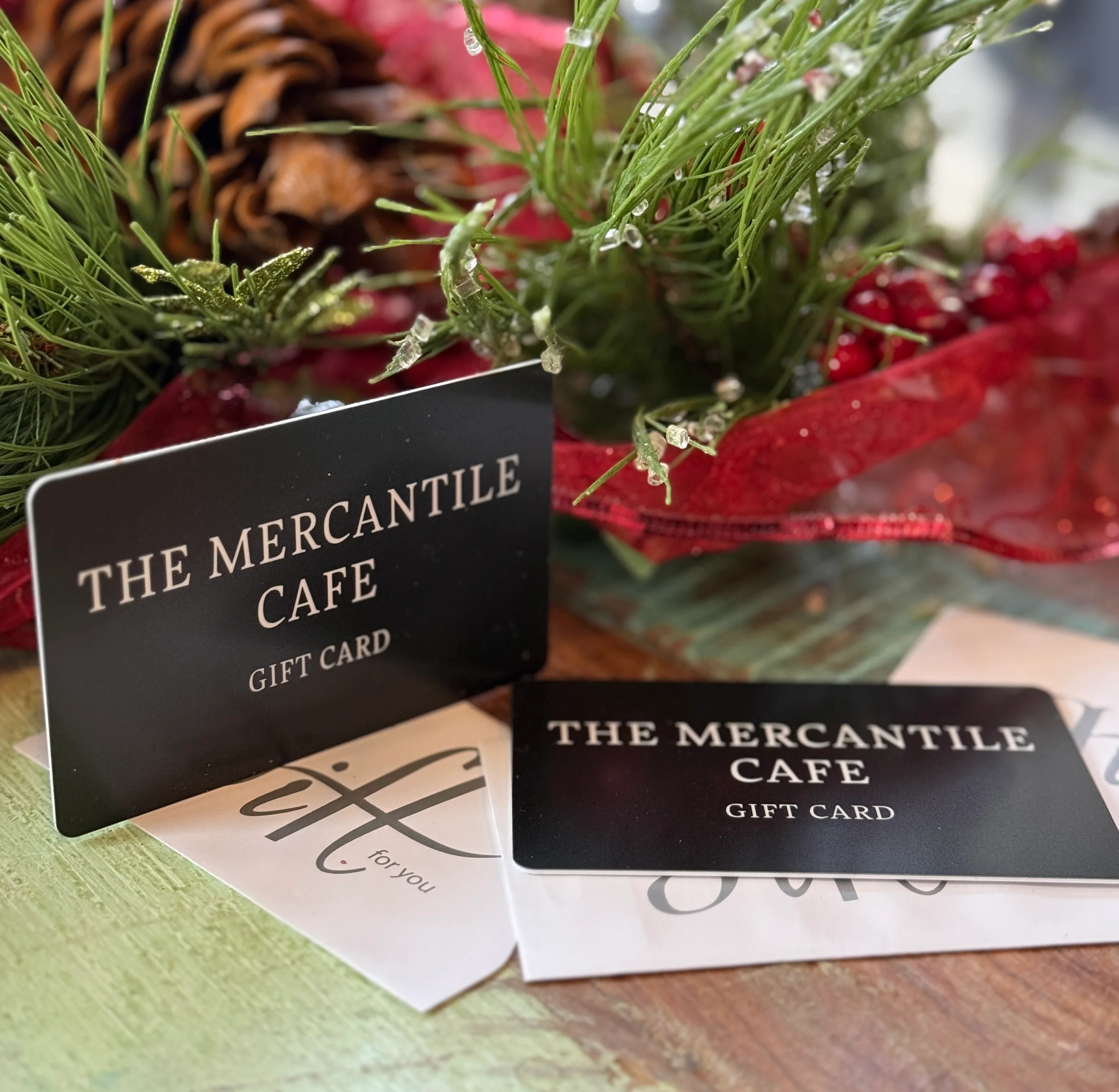 Gift cards for The Mercantile Cafe on a festive table setting