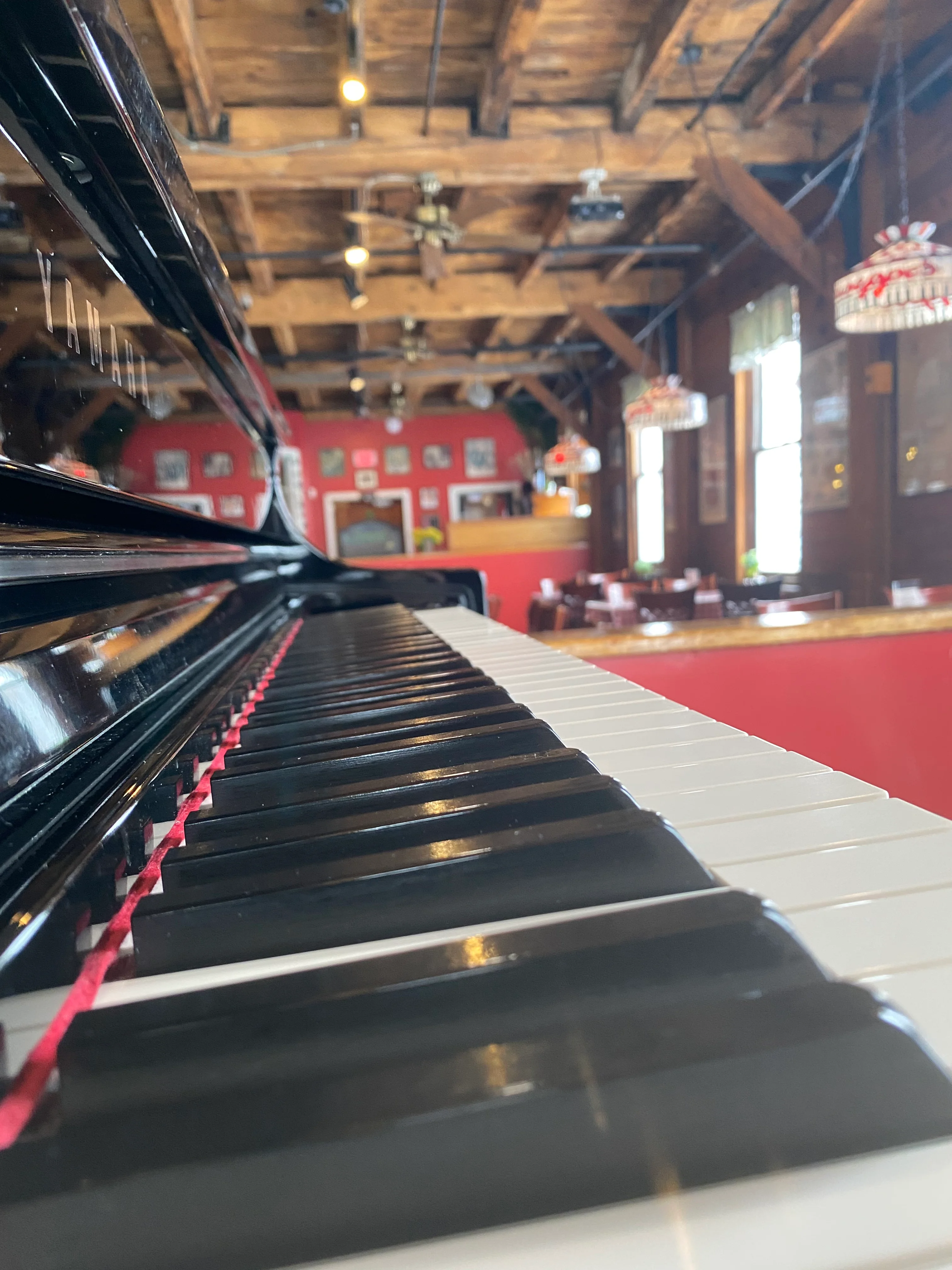 The piano in the dining room at Giuseppe's, where live music plays nightly
