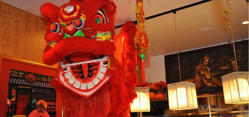 Vibrant Chinese lion dance decoration in a restaurant