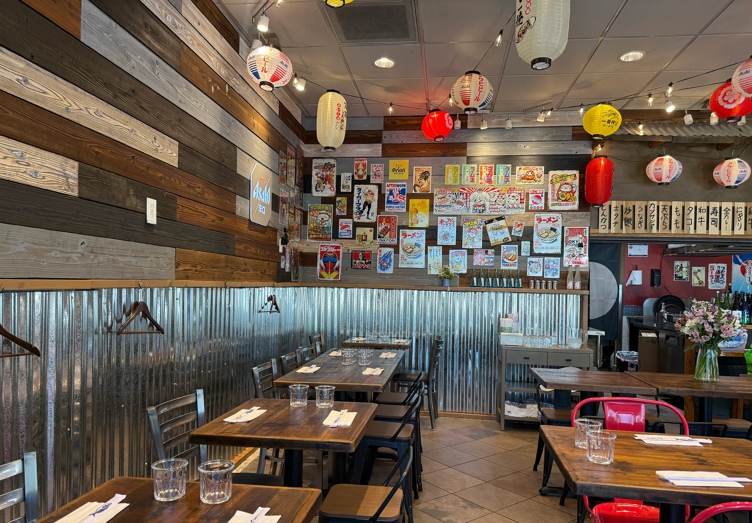 Cozy restaurant interior with wooden walls and colorful lanterns