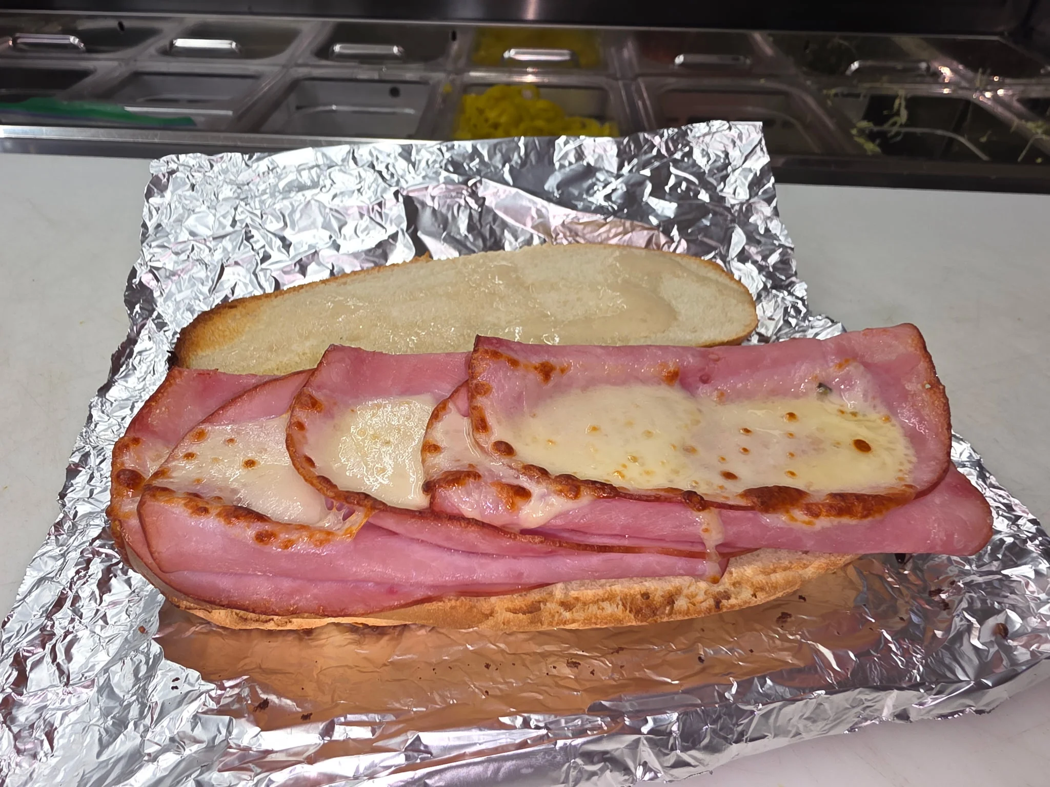 Italian ham and cheese sandwich on a toasted hoagie roll