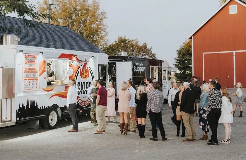 Food trucks serving guests at an outdoor event