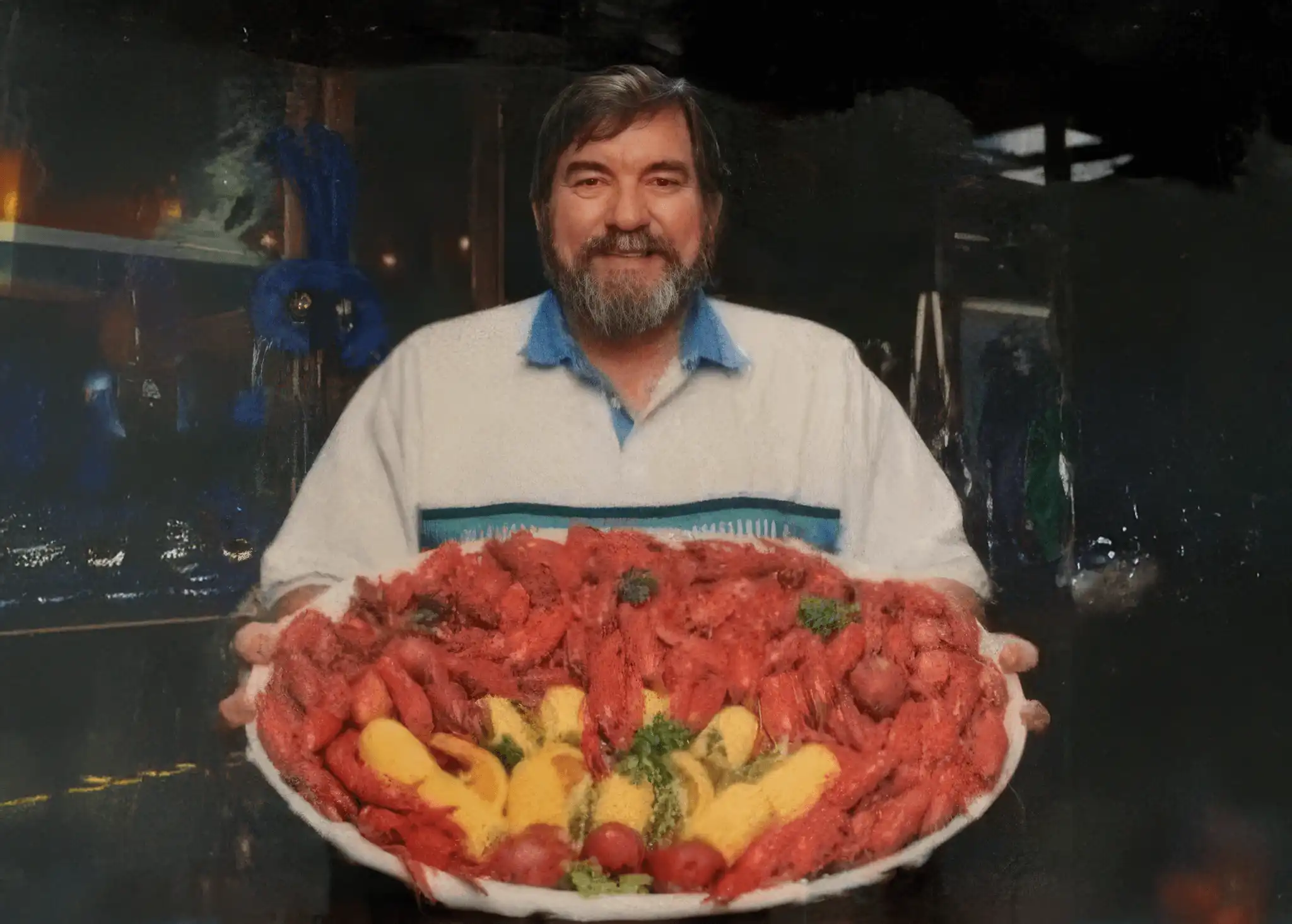 Barron T. Broussard holding a platter of delicious crawfish.