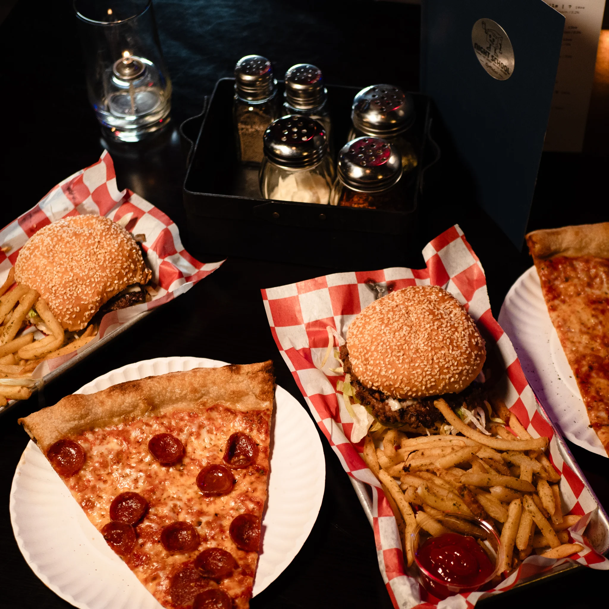 Burgers with Fries and Slices of Pizza