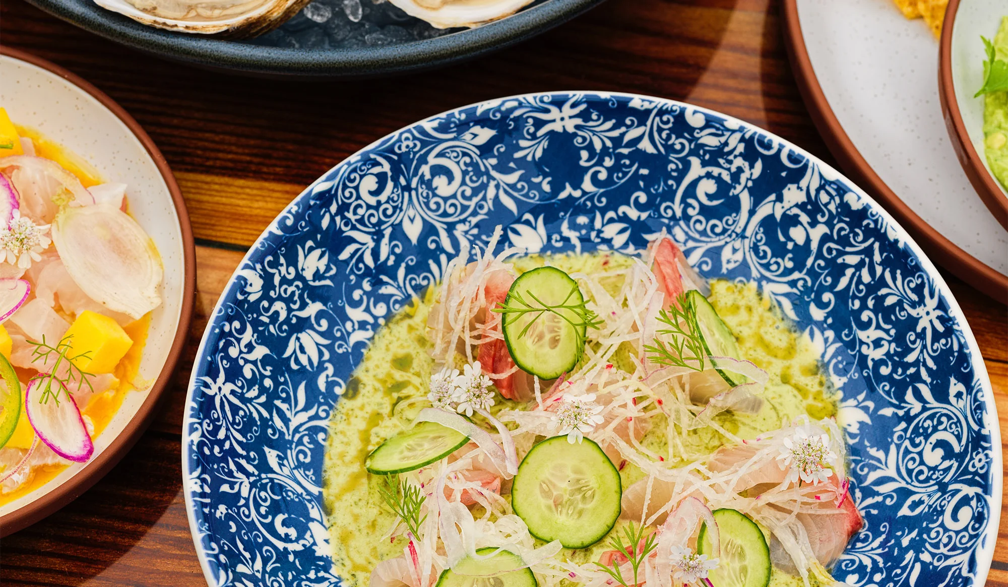 Ceviche with fresh fish and herbs in a decorative bowl