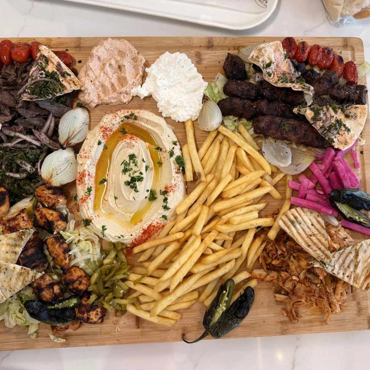 Mediterranean mezze platter with hummus and olives