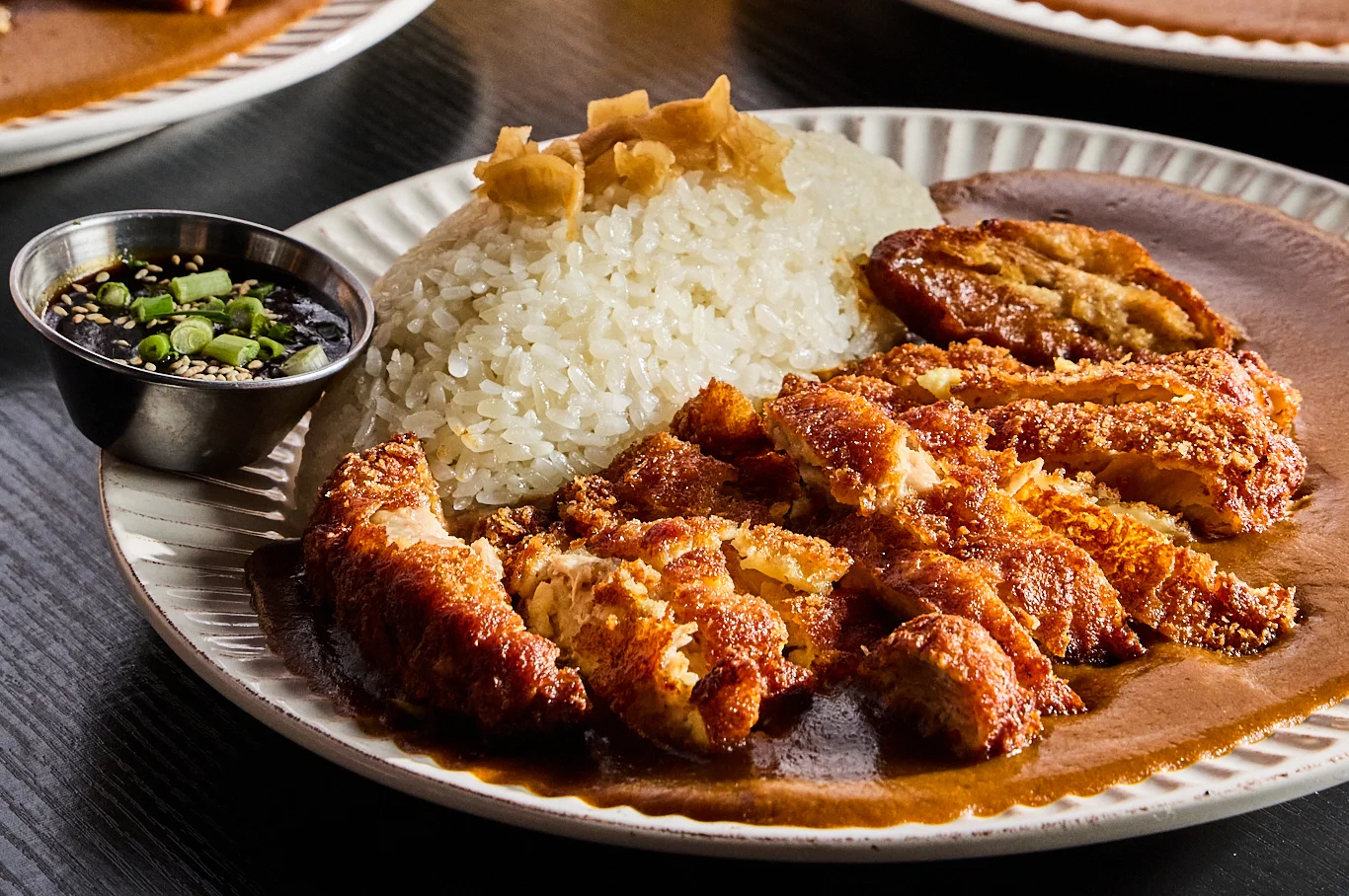 Filipino chicken adobo with rice and dipping sauce