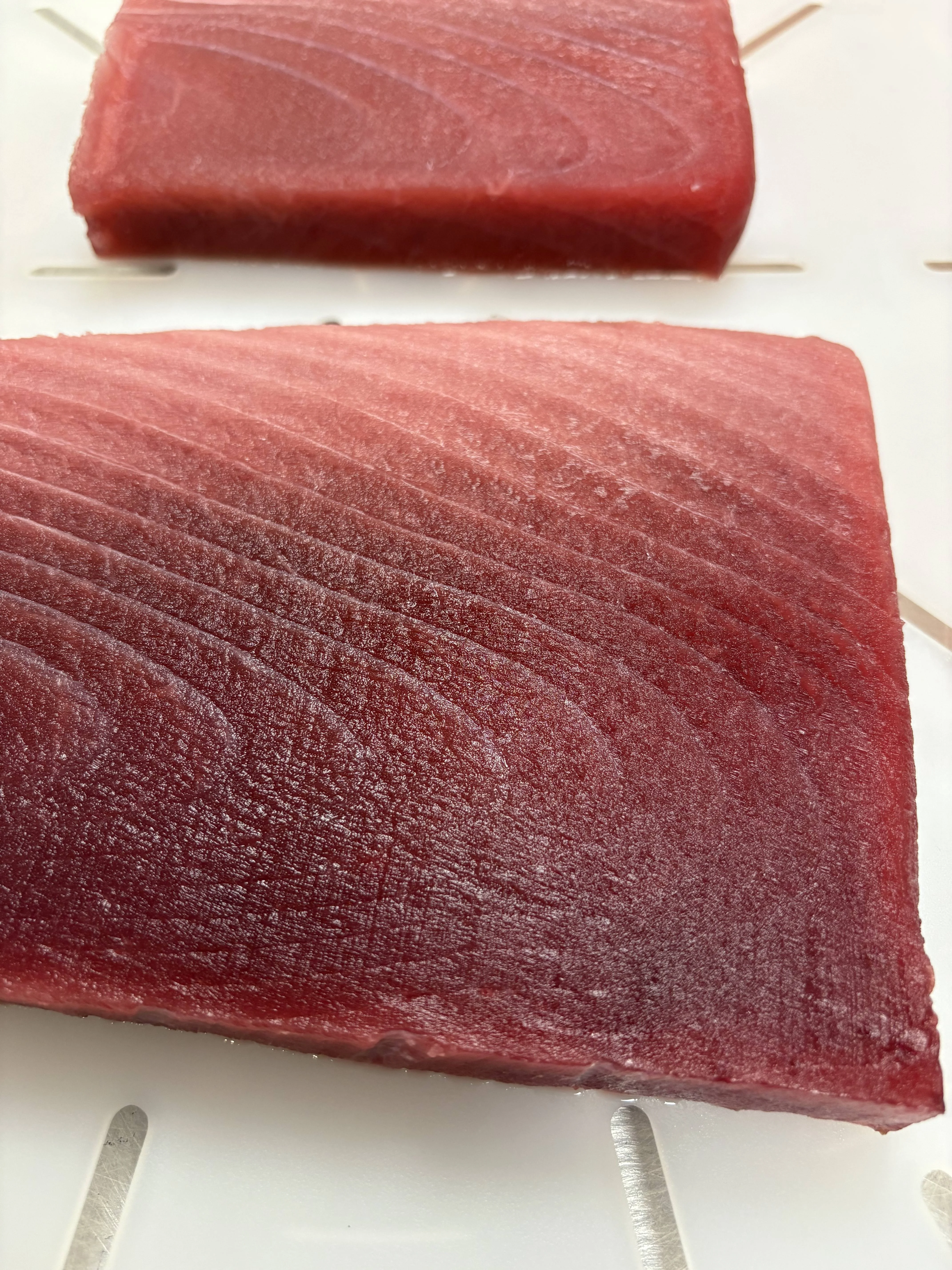 Fresh sushi-grade tuna fillets ready for preparation