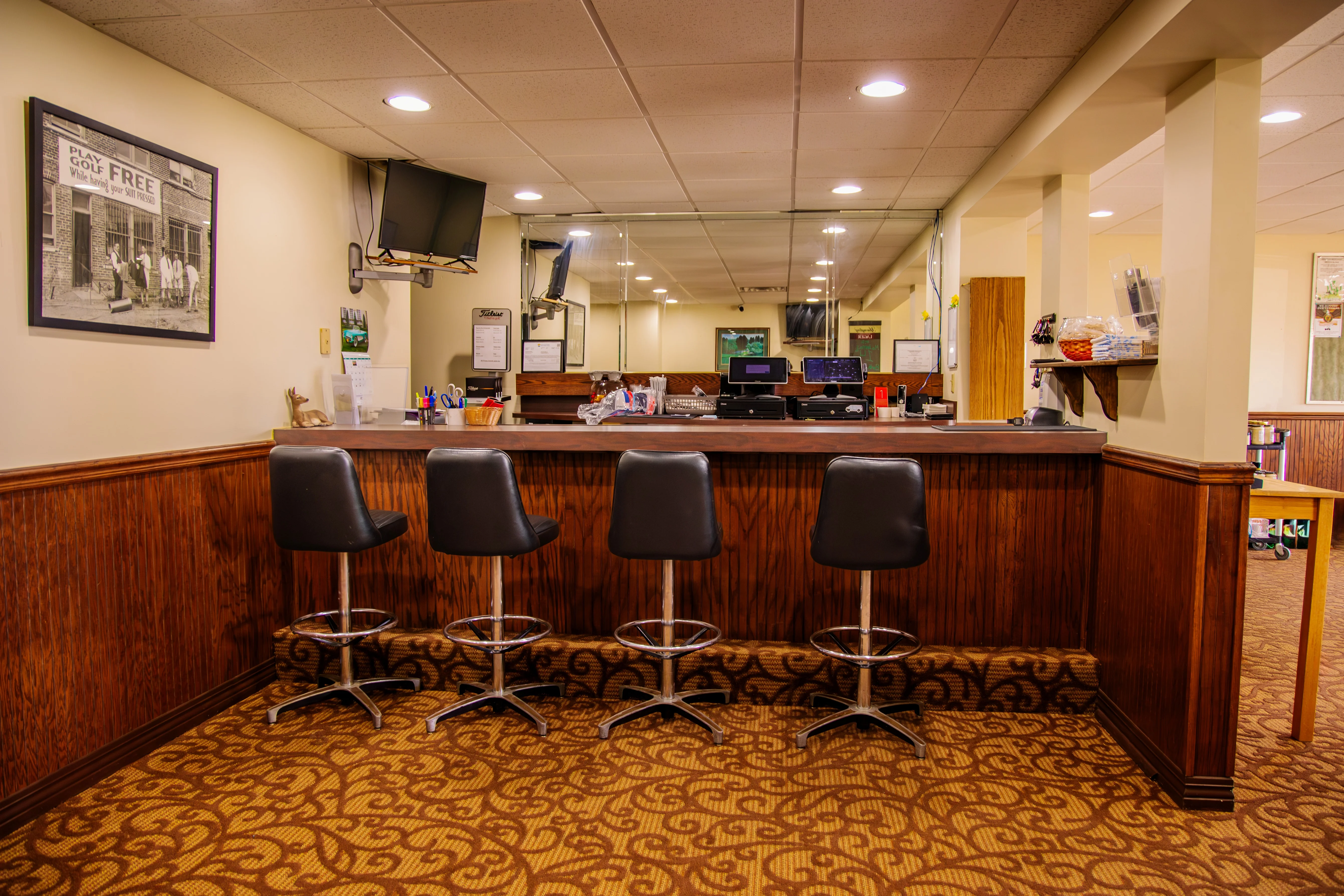 Cozy bar area with high stools and warm lighting