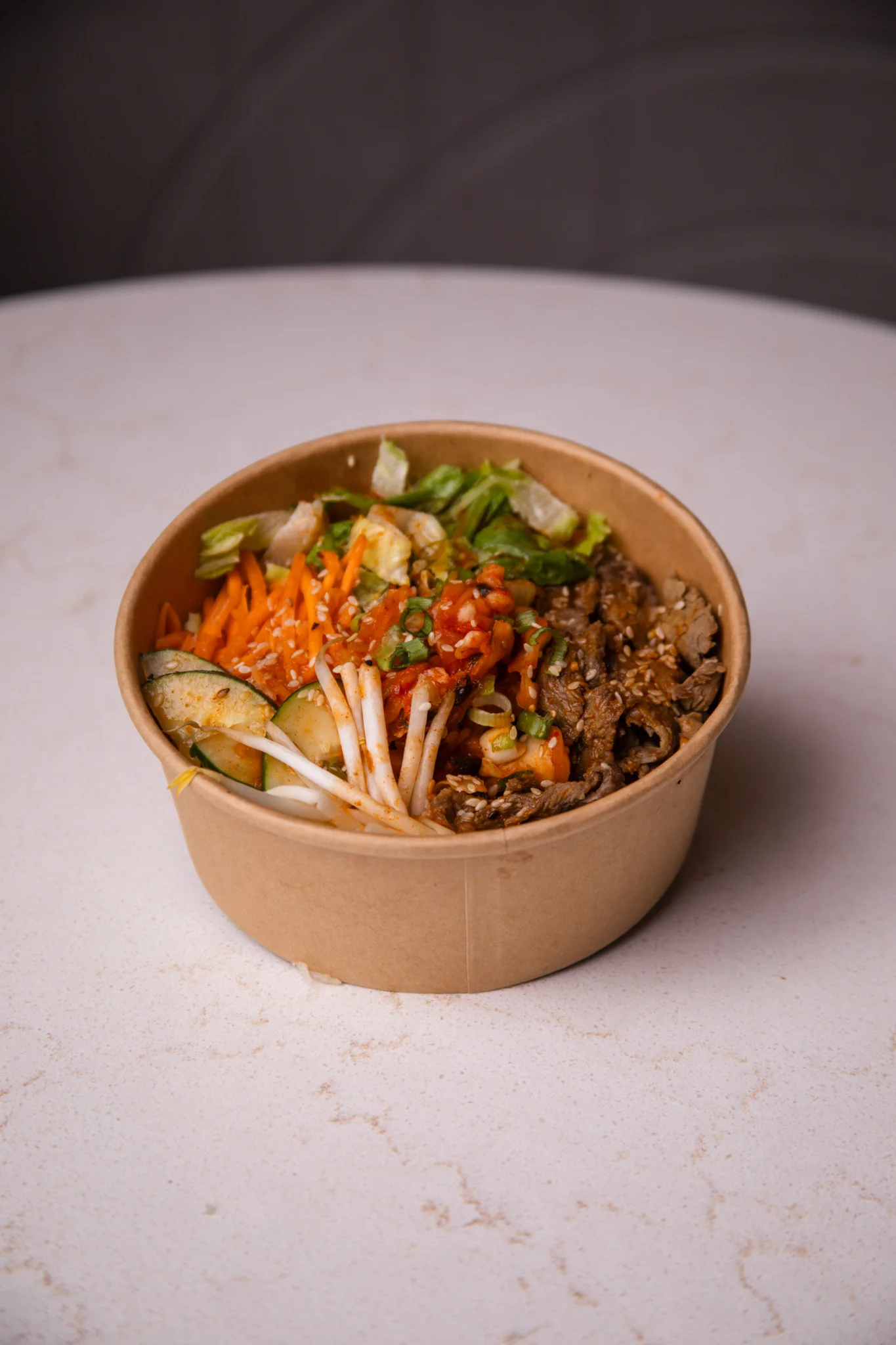 Korean beef bibimbap in a takeout bowl