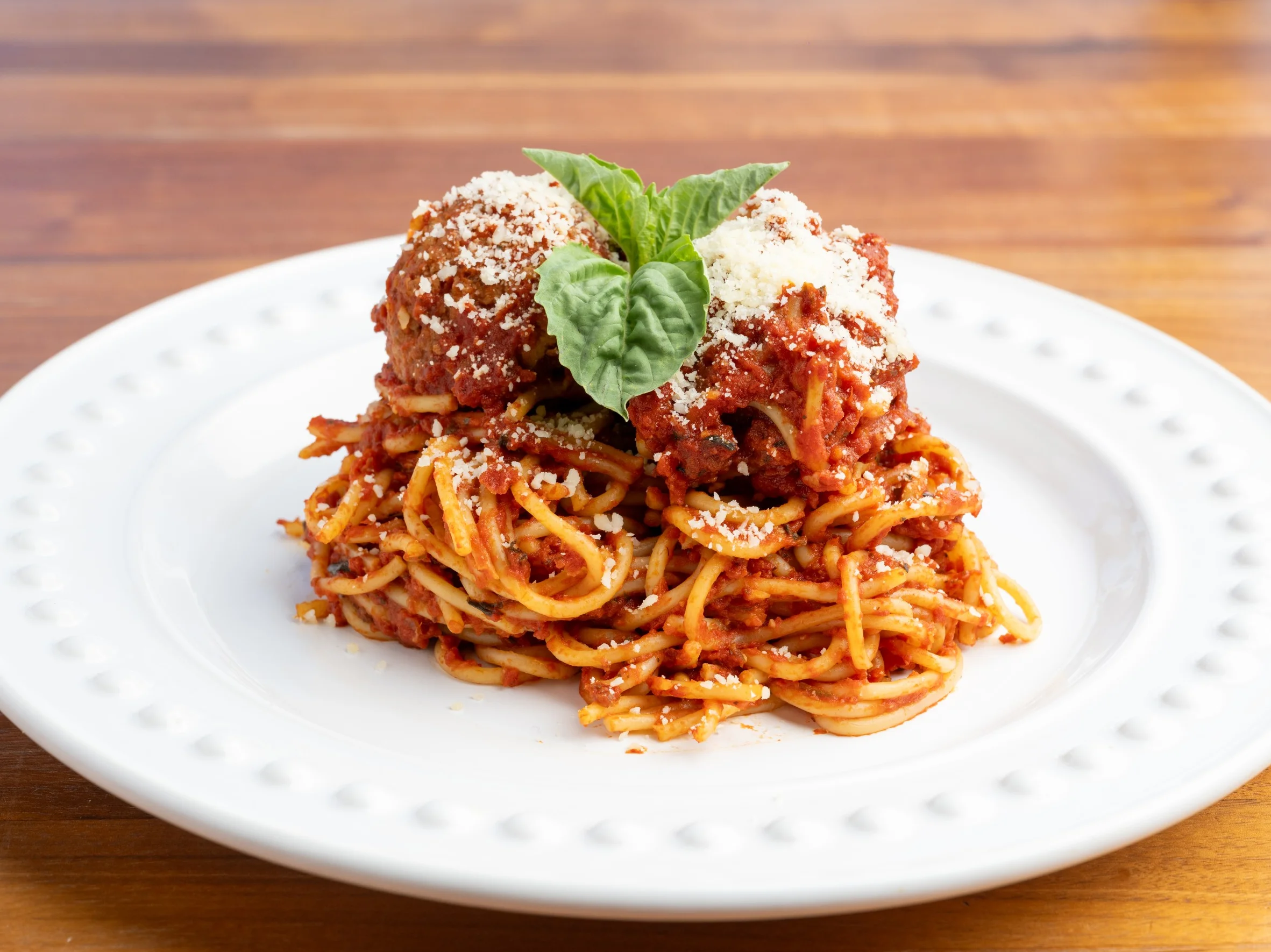 Spaghetti and Meatballs on a white dinner plate
