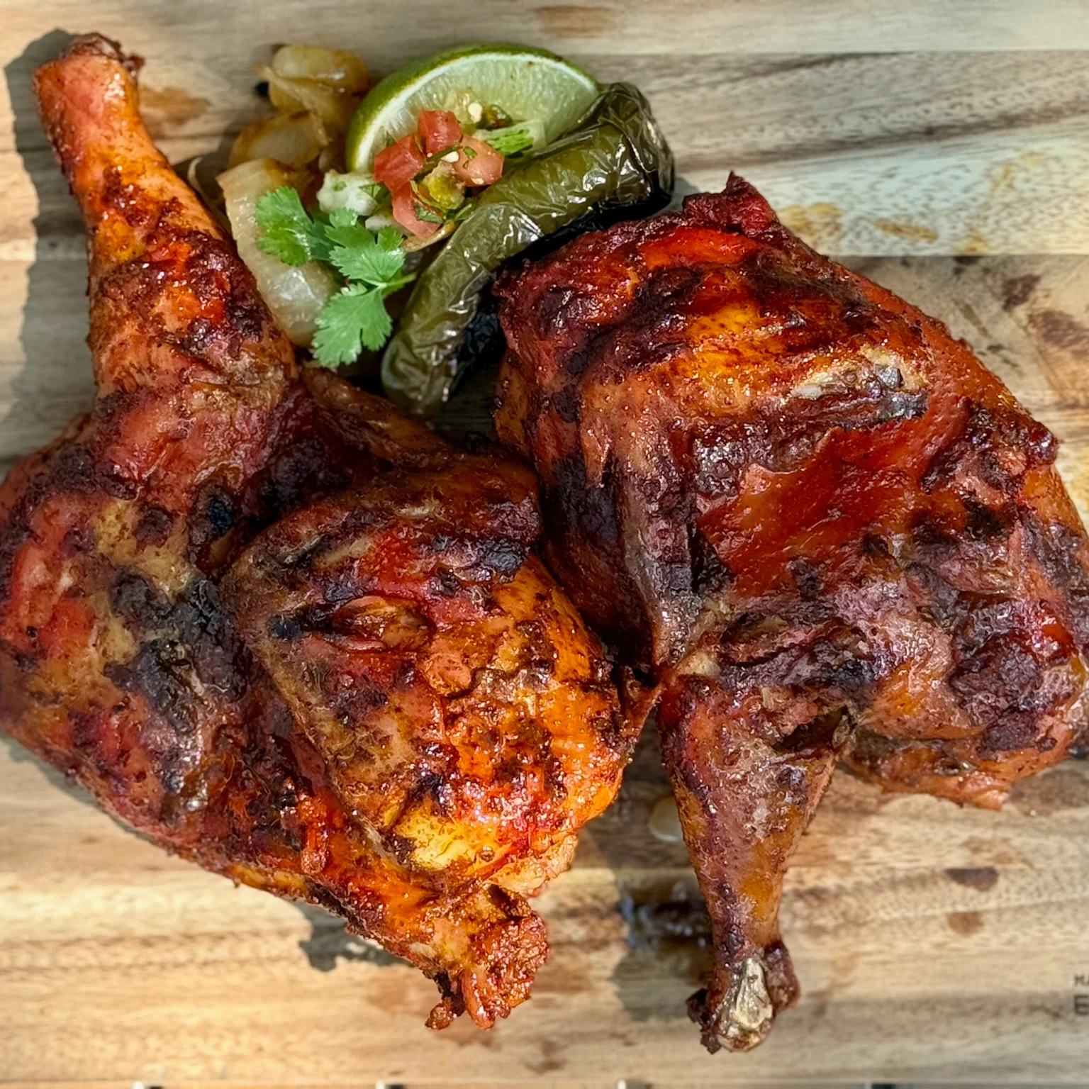 Grilled Mexican pollo al carbon with lime and salsa