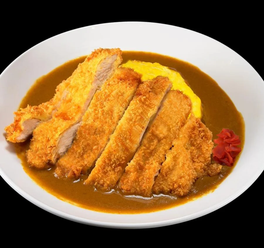 Japanese katsu curry with crispy pork cutlet and fluffy rice