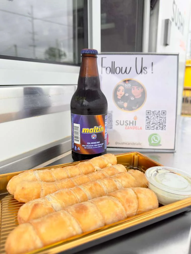 Cuban pan con bistec with a malt beverage