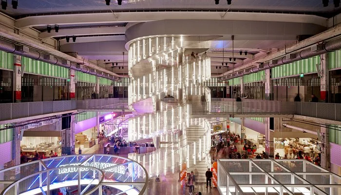 Modern restaurant interior with spiral staircase and vibrant dining areas